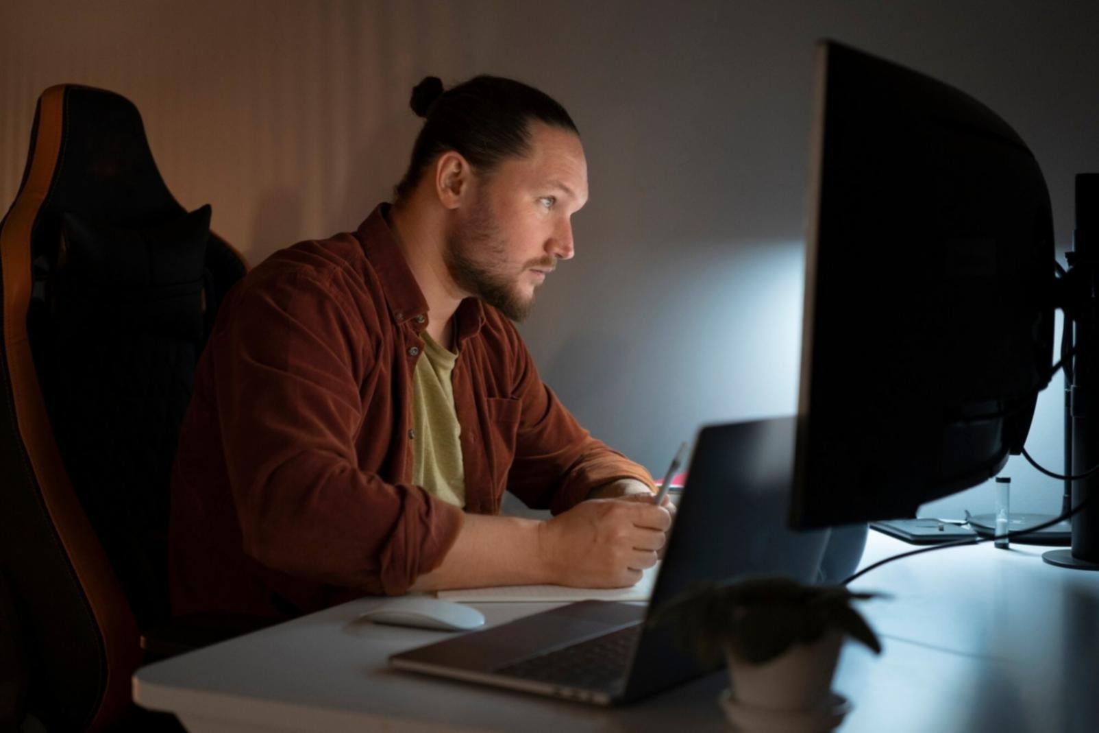 Student working on a laptop during a cloud machine learning finance session